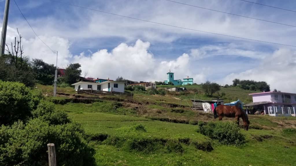 Village with a teal church