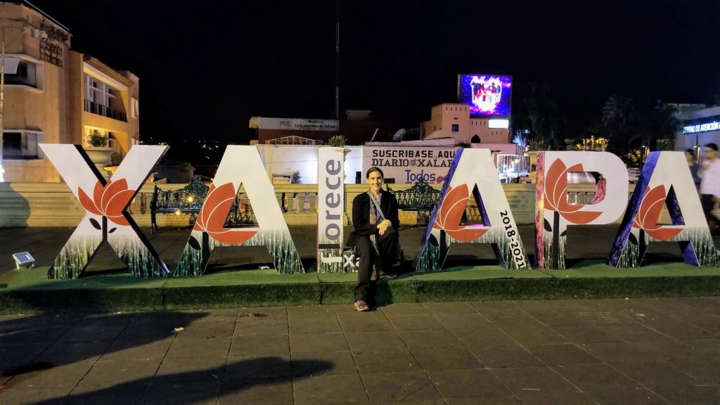 Lis manifests herself in front of Xalapa letter sign.