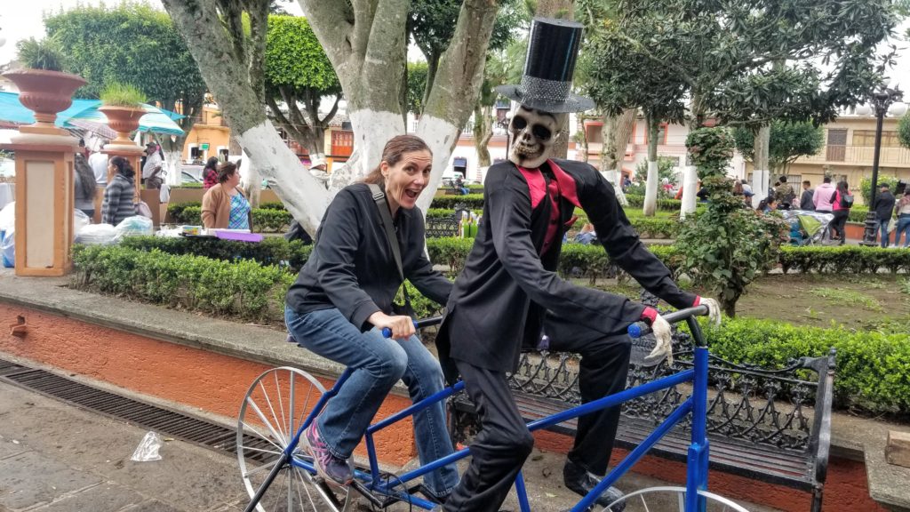 Lis on bicycle with Catrina in a tuxedo. Look, I manifested a groom!