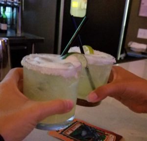 Toasting two margaritas