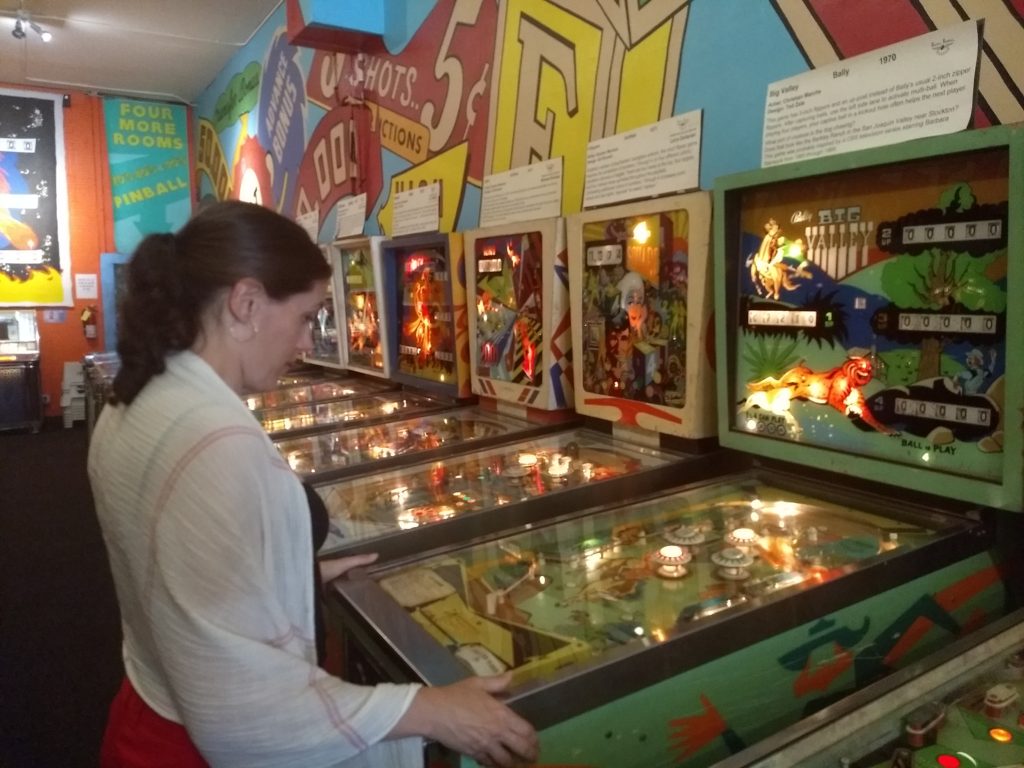 Lis playing pinball.