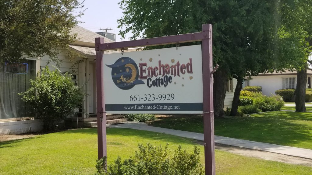 The enchanted cottage sign out front. 