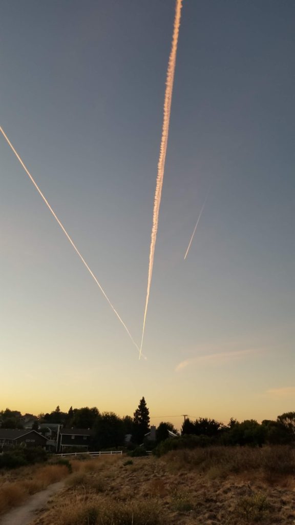 Plane trails in a morning sky