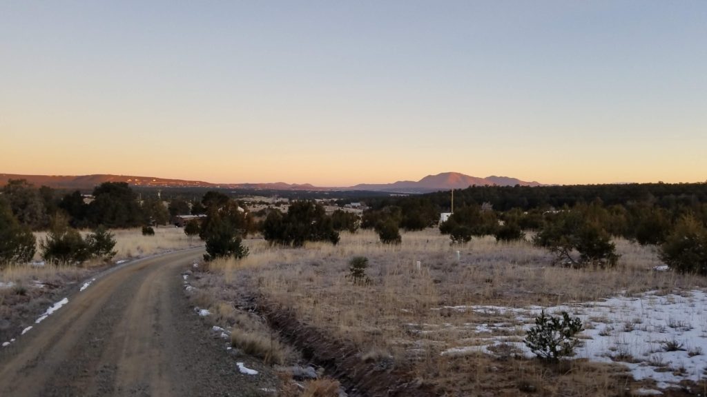 High desert terrain with mountains in the background