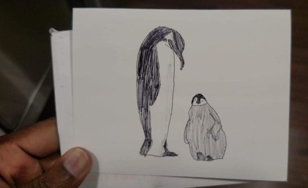 Note card with illustrated penguins.