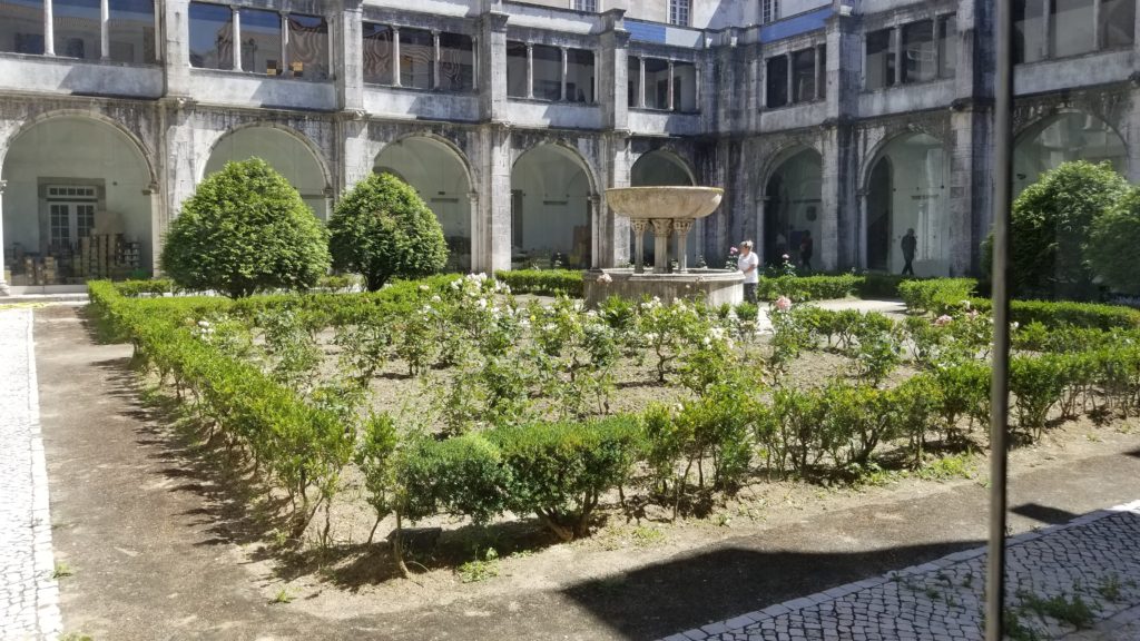 Garden courtyard with a large fountain.